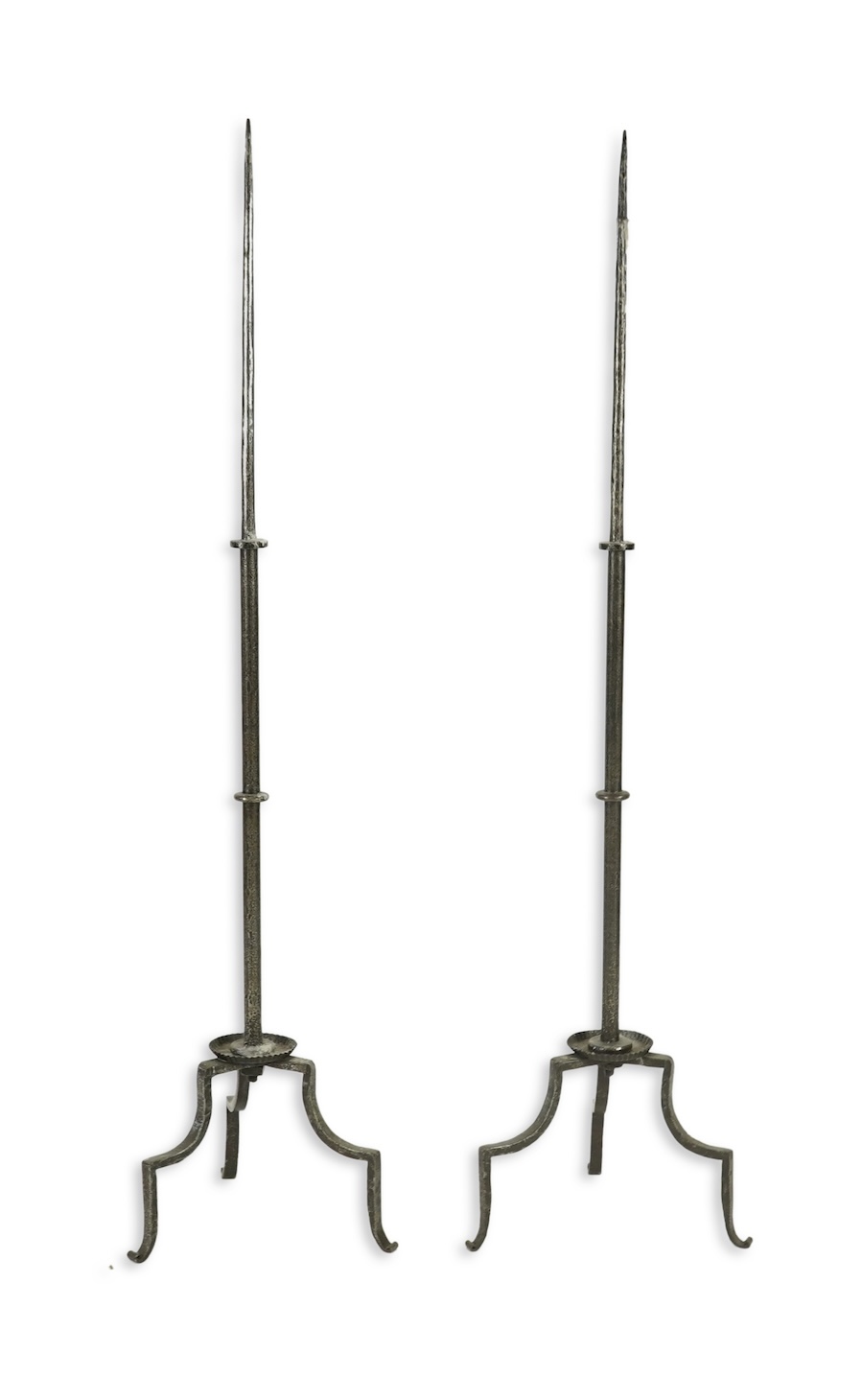 A pair of standing iron pricket candlesticks